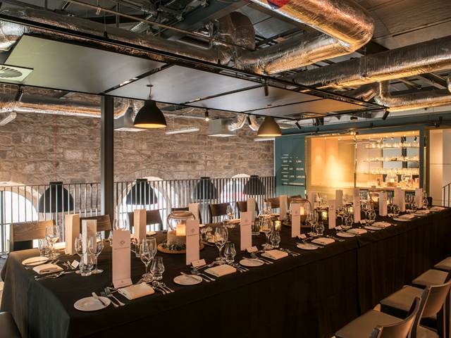 One dining set up for 20 places in the Tasting Room at The Clydeside Distillery