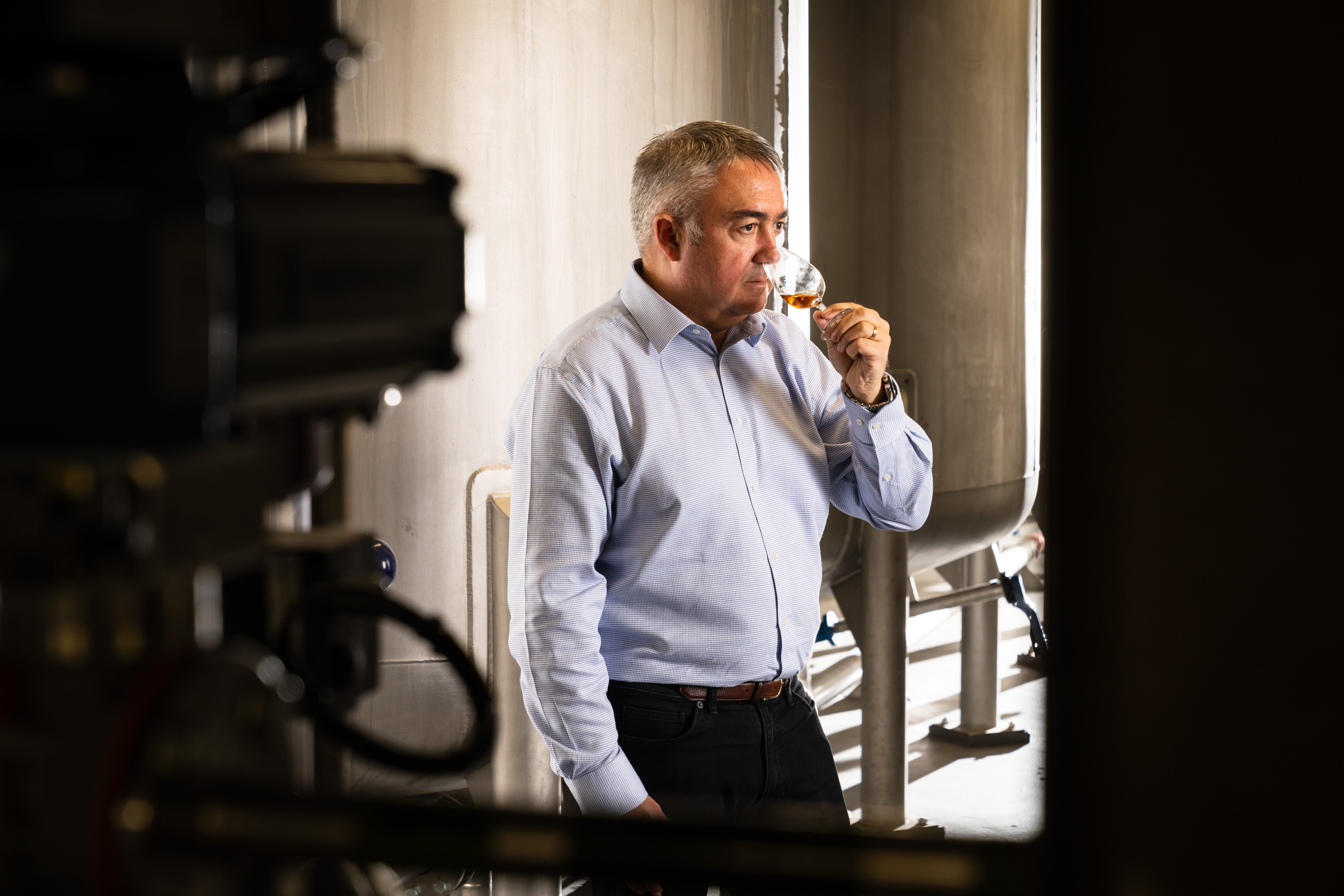 Distillery Manager, Alistair McDonald nosing whisky in a production area of The Clydeside Distillery