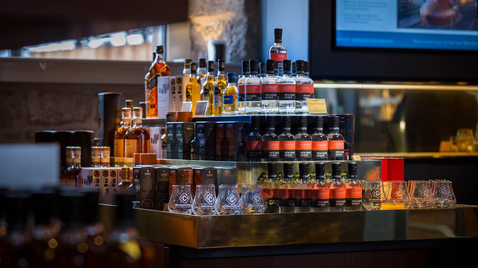The Clydeside Distillery retail shop, includes display island of New Make Spirit and other miniature bottles 