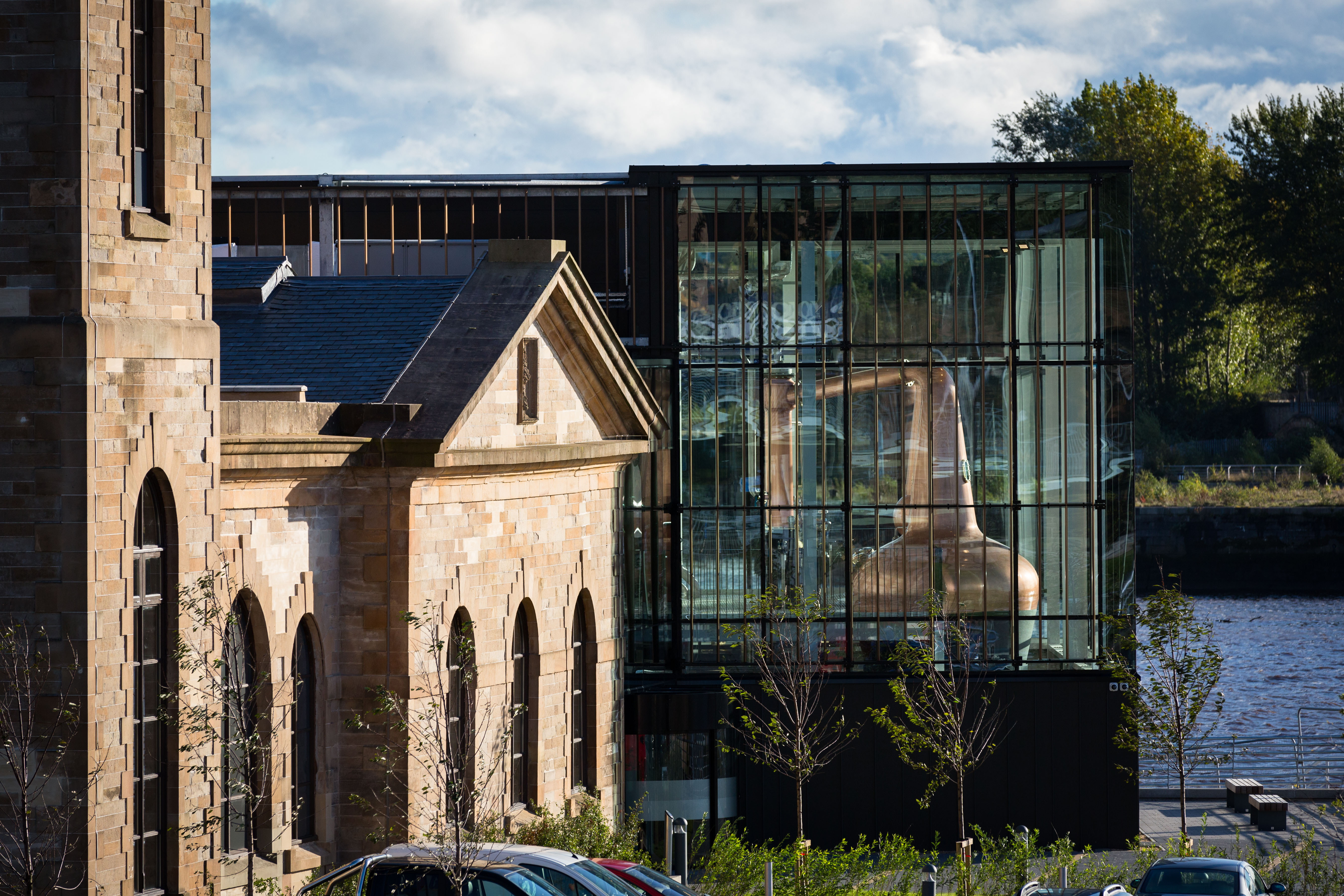 External image of The Clydeside Distillery - includes contrast of old building and glass Still House