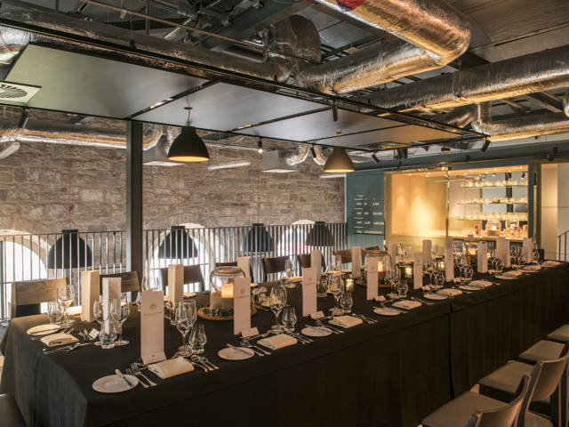 One dining set up for 20 places in the Tasting Room at The Clydeside Distillery